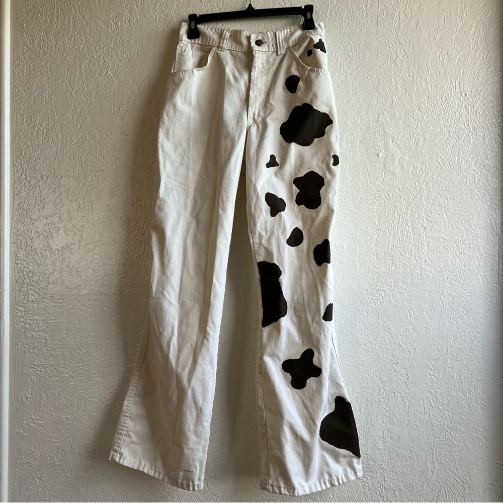 White denim pants with cow print decoration painted on